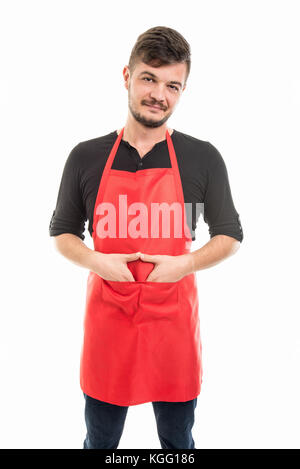 Supermercato maschio datore di lavoro in piedi con le mani nelle tasche isolati su sfondo bianco Foto Stock