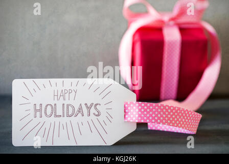 Regalo rosa, calligrafia, testo Happy Holidays Foto Stock