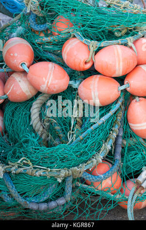 Green fishing nets with orange floats on quayside, Gilleleje, Zealand, Denmark, Europe Foto Stock