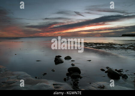 Tramonto in inverno a Kimmeridge Bay, su Jurassic Coast, Dorset Foto Stock