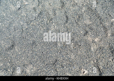 Scoria vulcanica sparsi ai piedi del vulcano, sullo sfondo delle piccole pietre porose Foto Stock