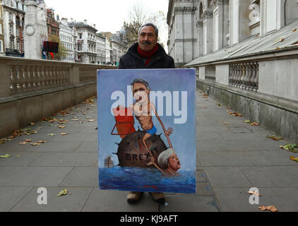 Londra, Regno Unito. 22 nov, 2017. artista kaya mar con uno dei suoi dipinti raffiguranti il cancelliere dello scacchiere philip hammond e del primo ministro britannico in una situazione brexit sul giorno di bilancio, Downing Street, Londra, Gran Bretagna, 22 novembre, 2017. Credito: Paolo marriott/alamy live news Foto Stock