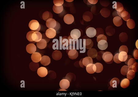 Sfondo di natale. festosa vacanze astratta con sfondo bokeh defocalizzata luci e stelle, tonica. arancione cerchi sfocata lontano dal fuoco d'artificio Foto Stock