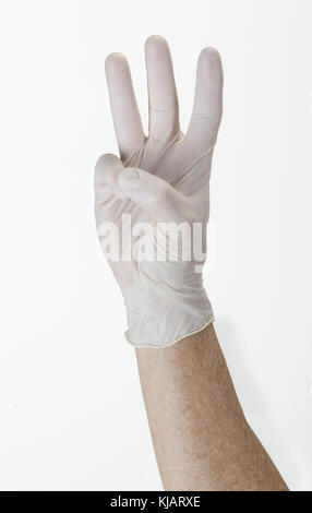 Guanto guanti mano indicante la numerazione a tre Foto Stock