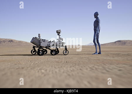 Alien guardando piccolo veicolo nel deserto Foto Stock