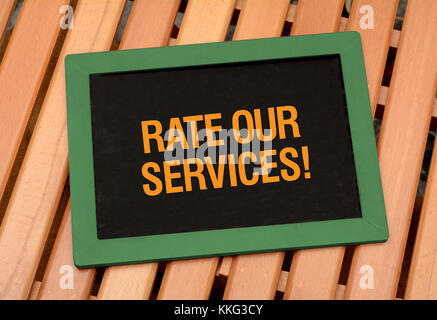 Rate services - customer care concetto sulla lavagna Foto Stock