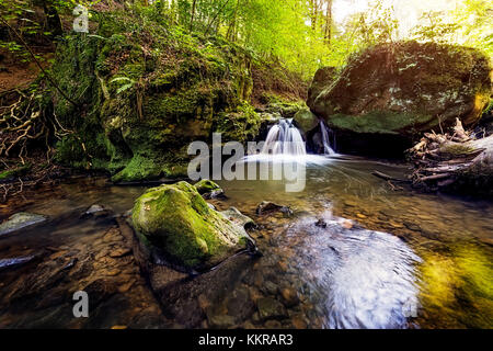 Cascate nel Mullerthal, lokally noto come Schiessentuempel Foto Stock