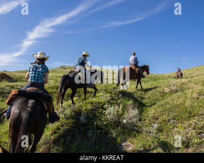 Equitazione su dude ranch Foto Stock