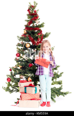 Ragazza vicino albero di natale Foto Stock