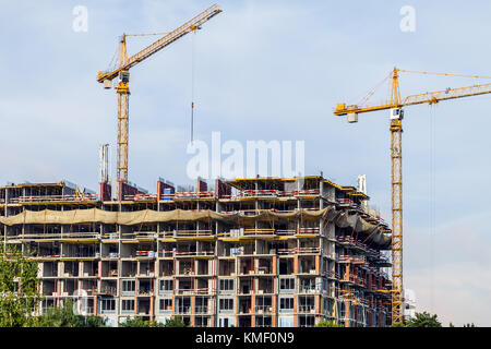 Crains sul cantiere di costruzione Foto Stock