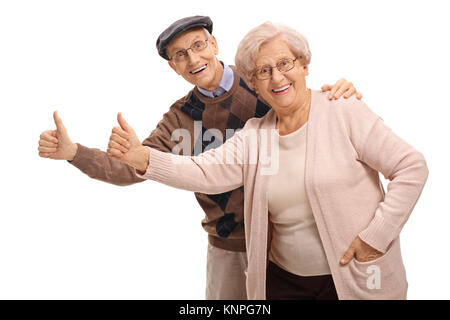 Allegro anziani mantenendo le loro pollice in alto isolato su sfondo bianco Foto Stock