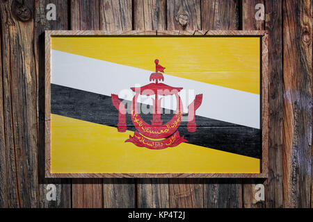 3D rendering del Brunei bandiera su un telaio di legno su una parete di tavole Foto Stock