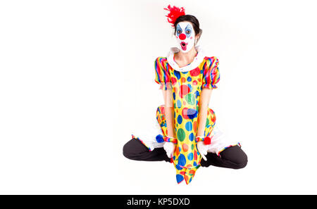 Colorato Circus Clown Jumping Flying Mid-Air nella Polka Dots Foto Stock