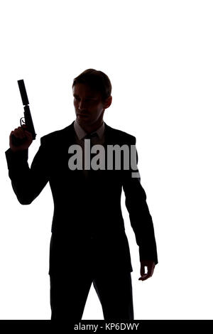 Silhouette di uomo in business suit con la pistola in mano isolati su sfondo bianco Foto Stock