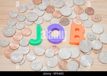 Alfabeto di lavoro con varie monete statunitensi Foto Stock