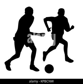 Giovani uomini che giocano a calcio Foto Stock