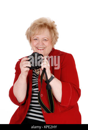 Nonna felice di scattare le foto. Foto Stock