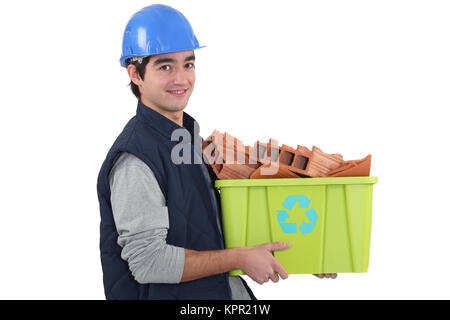 Giovani riciclaggio builder Foto Stock