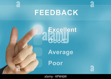 Business mano spingendo il pulsante di feedback Foto Stock