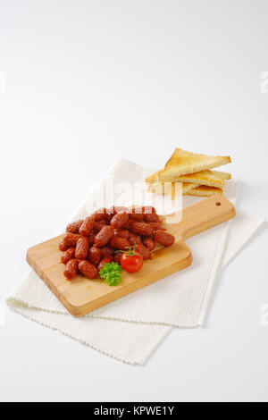 Mini salsiccia secca e toast Foto Stock