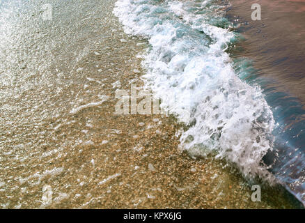 Sea Wave al tramonto Foto Stock