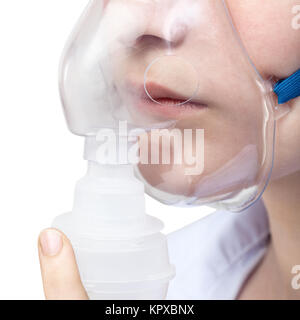 Teen respira con maschera facciale del nebulizzatore close up Foto Stock