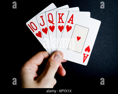 Mano di Poker Royal Flush su sfondo nero Foto Stock