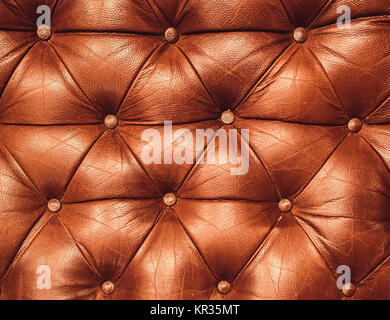 La texture di vera pelle mobili imbottiti. Decorative sfondo marrone. Sfondo decorativo di vera pelle capitone texture Foto Stock