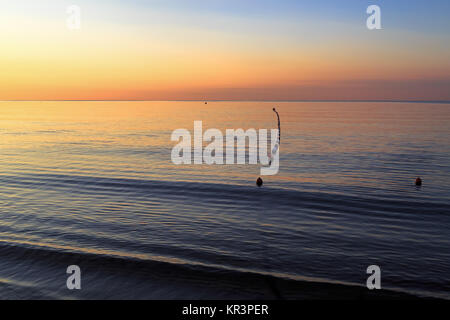 Alba sul mare Foto Stock