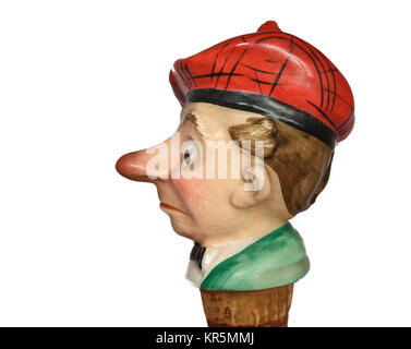 Un vecchio sughero tappo di bottiglia nella forma di un fumetto caricatura di naso rosso scozzese. Foto Stock