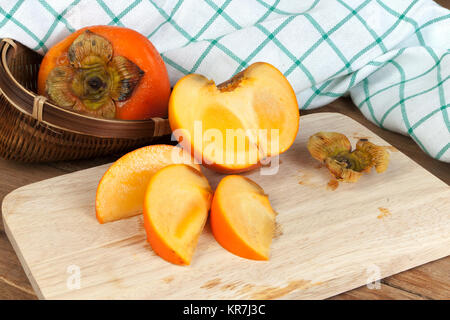 Persimmon colore giallo frutti Foto Stock