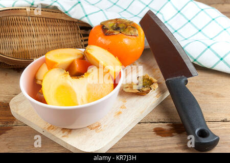 Persimmon colore giallo frutti Foto Stock