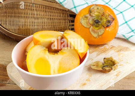 Persimmon colore giallo frutti Foto Stock