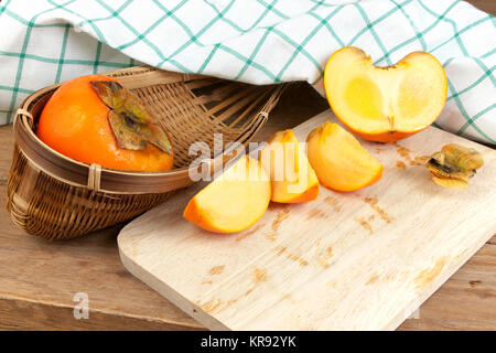 Persimmon colore giallo frutti Foto Stock