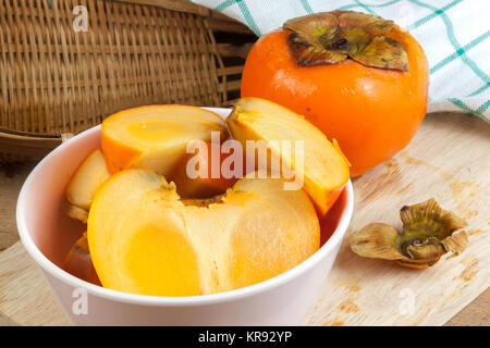 Persimmon colore giallo frutti Foto Stock