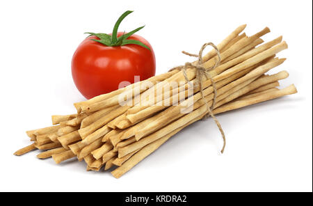 Croccante croccante pane lunghi bastoni con pomodoro. Foto Stock