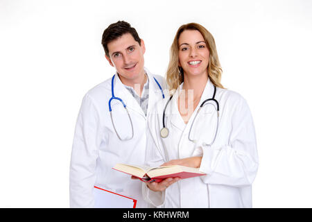Giovane, Gentile team di medici con libro in camice Foto Stock