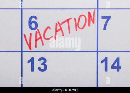 Vacanza parola scritta sul calendario Foto Stock