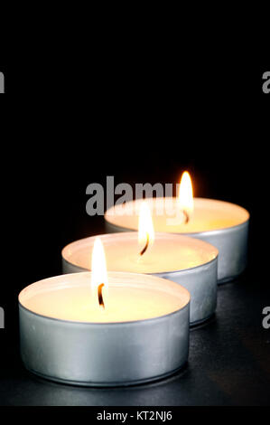 Profumato candals isolata contro uno sfondo nero Foto Stock