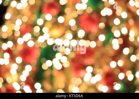 Albero di natale di luce astratta golden bokeh sfondo. Foto Stock