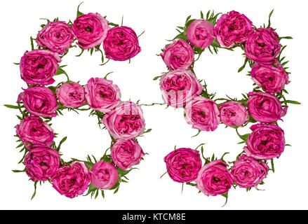 Numero arabo 69, sessanta nove, dal rosso dei fiori di rosa, isolato su sfondo bianco Foto Stock