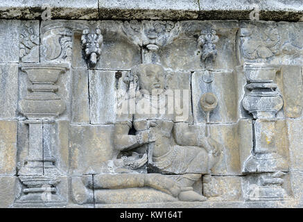 Dettaglio del buddista rilievo scolpite nel tempio di Borobudur in Yogyakarta, Java, Indonesia.. Foto Stock