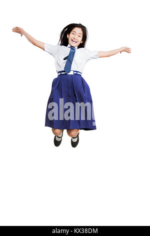 1 Indian ragazza giovane studente della Scuola Jumping allegro celebra con successo Foto Stock