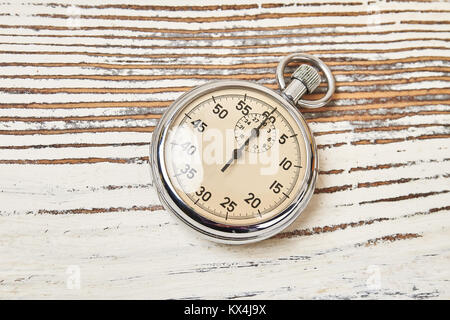 Cronometro retrò su sfondo rustico Foto Stock