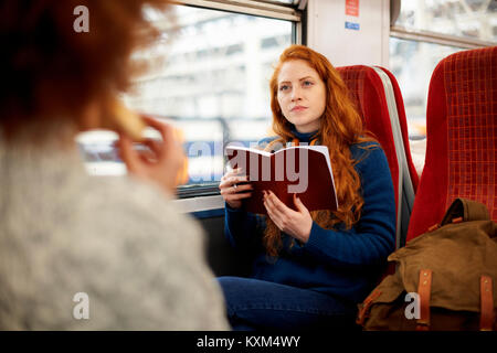 Gli amici sul treno,Londra Foto Stock