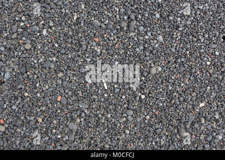 Il nero Sfondo sabbia, sabbia vulcanica in Indonesia Foto Stock