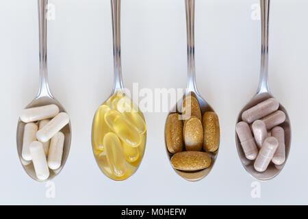 Supplementi sani su cucchiaini Foto Stock