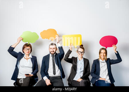 La gente di affari azienda bolle colorate Foto Stock