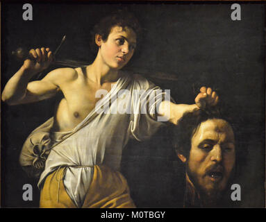 Il dipinto di Caravaggio *Davide e Golia* illustra la storia biblica della vittoria di Davide su Golia. Il dipinto è rinomato per il suo uso drammatico di luci e ombre, segno distintivo dello stile di Caravaggio. Foto Stock