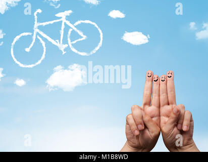 Felice allegro smiley dita guardando una bicicletta shapeed cloud Foto Stock
